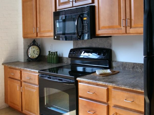 wooden cabinets and drawers in apartment complex