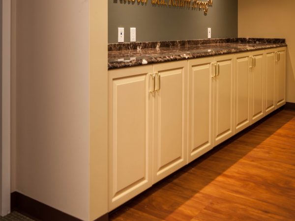 new granite countertop and white cabinets