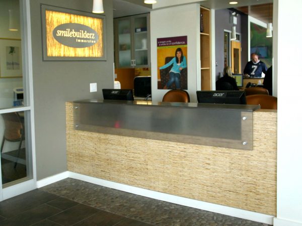 wooden reception desk at dental office