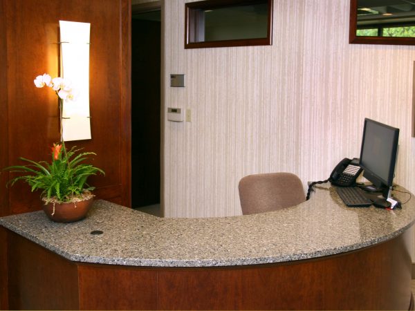 custom wooden and granite reception desk
