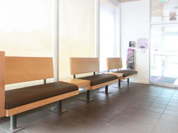 wooden constructed benches in dental office