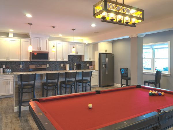 downstairs kitchen bar with white cabinets