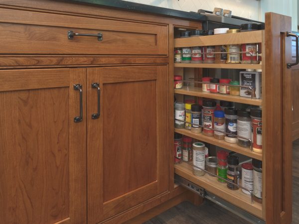 hidden spice rack in wooden cabinets