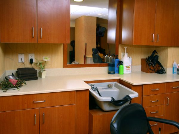 custom built kitchen counter with wooden cabinets