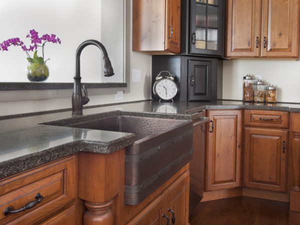 black laminate kitchen countertops with wooden cabinets