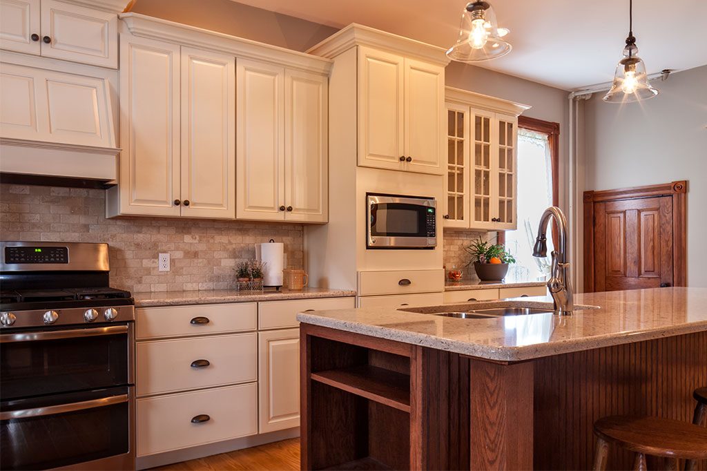 cream kitchen cabinets with granite kitchen island