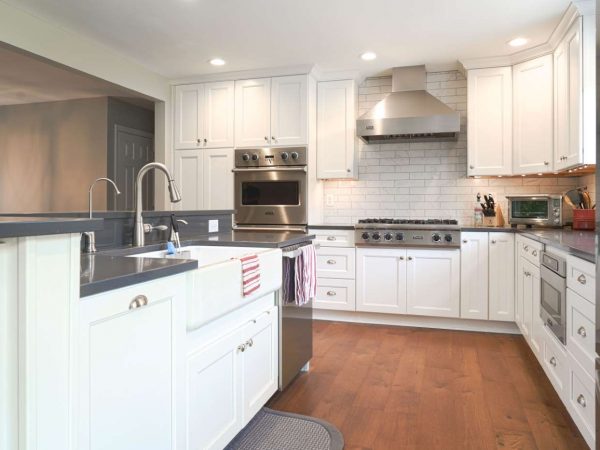 white kitchen cabinets with gray laminate countertop