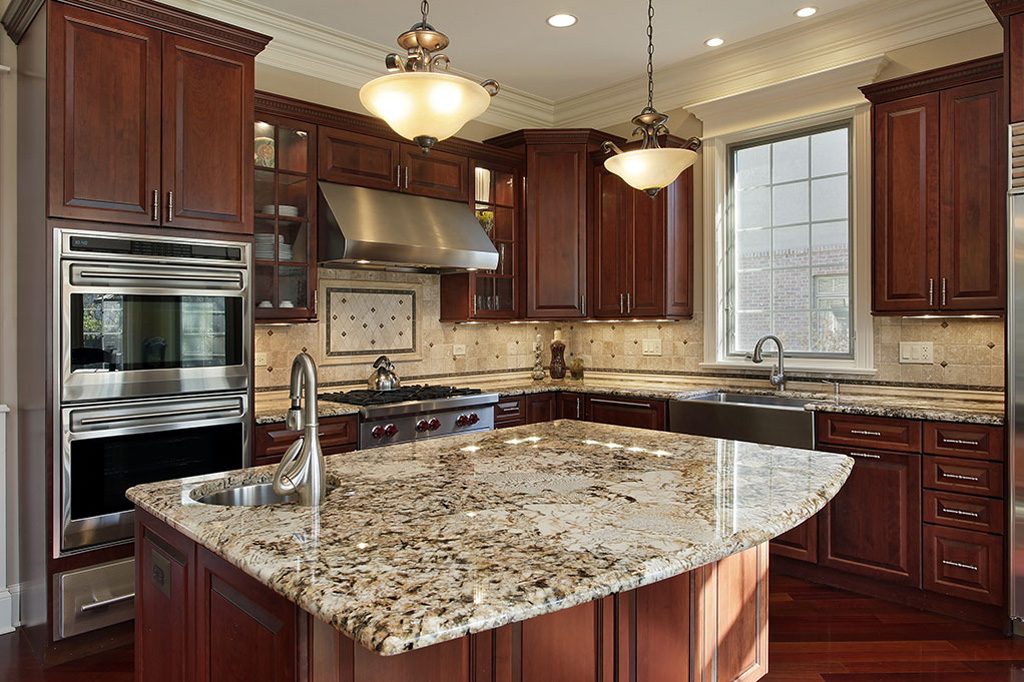 granite kitchen countertop and brown kitchen cabinets