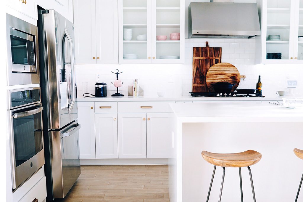 white kitchen countertops and cabinets