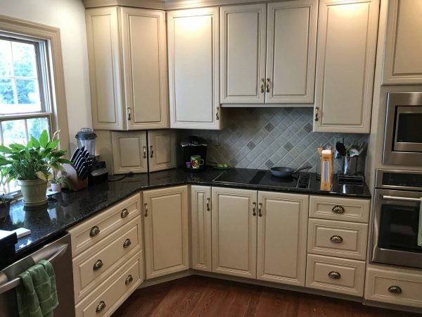 tan cabinets and black laminate countertops