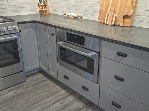 dark gray pull out drawers in new kitchen