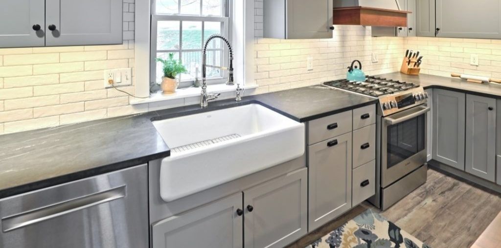 Gray kitchen cabinets and farmhouse sink