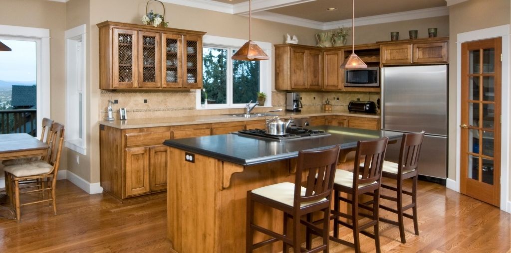 Modern farmhouse kitchen remodel with white cabinets and natural wood island