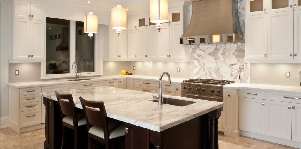 Modern farmhouse kitchen remodel with white cabinets and natural wood island