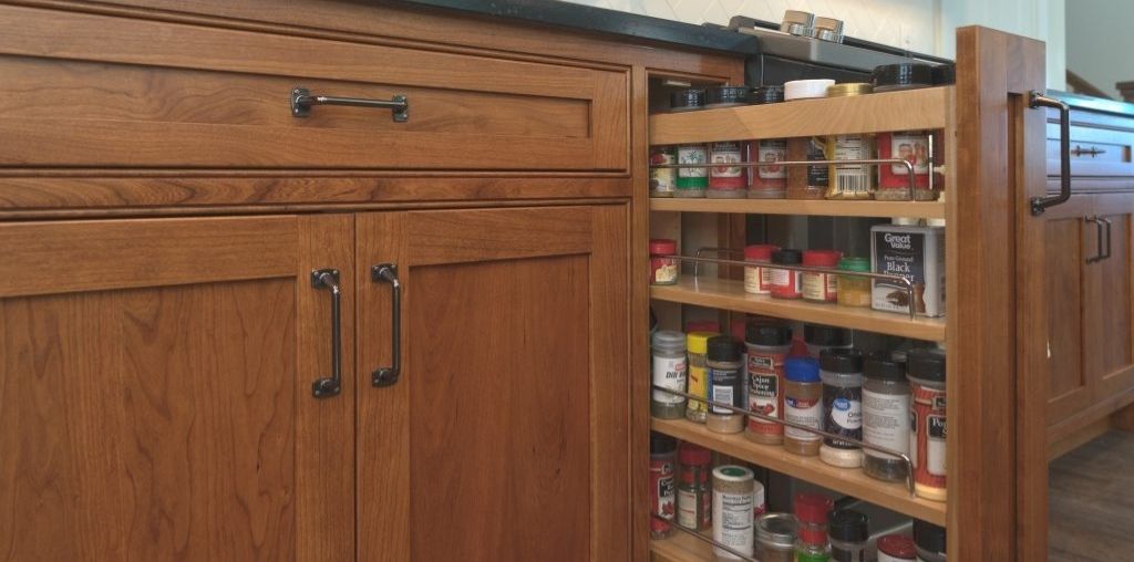 Pull out storage drawer for spices in kitchen